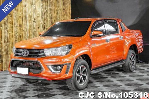 Toyota Hilux in Orange for Sale Image 0