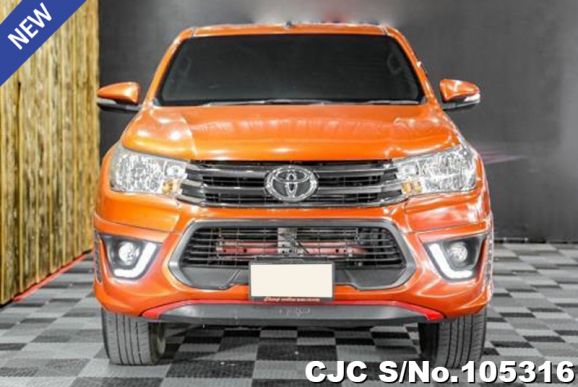 Toyota Hilux in Orange for Sale Image 2